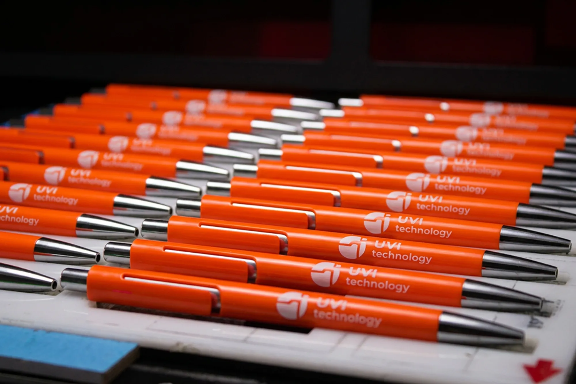 UV-printed pens coming off the machine in our Budapest printhouse
